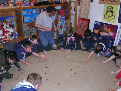 Bruce Teaching Marble Games to Scouts